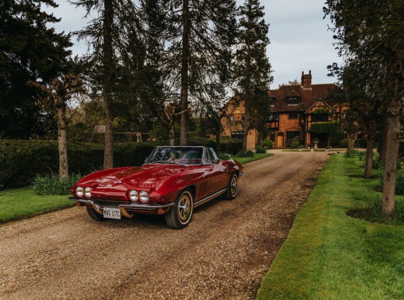Deep red Chevrolet Corvette parked in a driveway